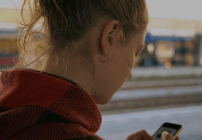 teen looking at phone
